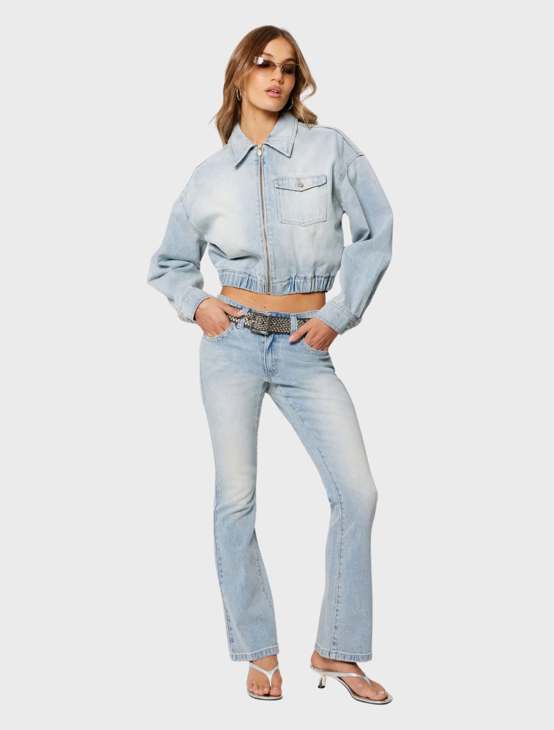 A woman in jeans and a crop top, showcasing the 99 Boot - Stella style.