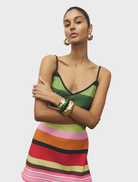 Emerald striped mini dress featuring a fitted silhouette and short sleeves, perfect for casual or semi-formal occasions.