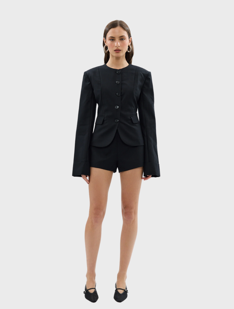 Black Alba Jacket laid flat, emphasizing its material and tailored fit.