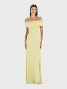 Stylish kiwi maxi dress with off-the-shoulder neckline, fitted silhouette, flared hem, and fully lined for a refined finish.