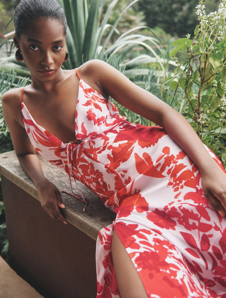Elegant geranium red Aleyna Plunged Maxi Dress with a plunging neckline and a long, flowing design for special events.