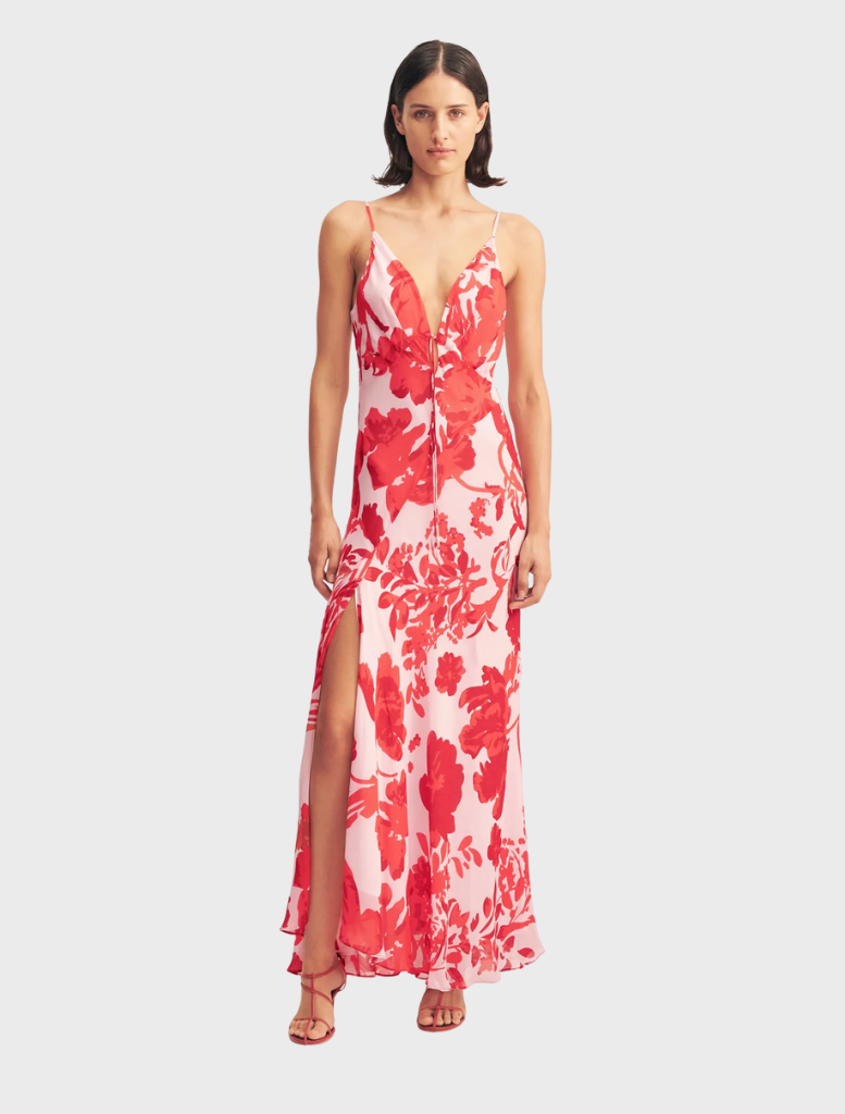 Geranium red Aleyna Plunged Maxi Dress, featuring a deep V-neckline and flowing silhouette, perfect for elegant occasions.