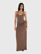Chocolate maxi dress featuring a fitted bodysuit, draped skirt, and adjustable halter tie for an elegant silhouette.
