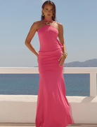 Hot pink Alola halter maxi dress featuring a ruched design, perfect for summer events and stylish outings.