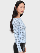 Stylish blue Amelia Top with a playful small dot pattern, ideal for a fashionable and casual appearance.