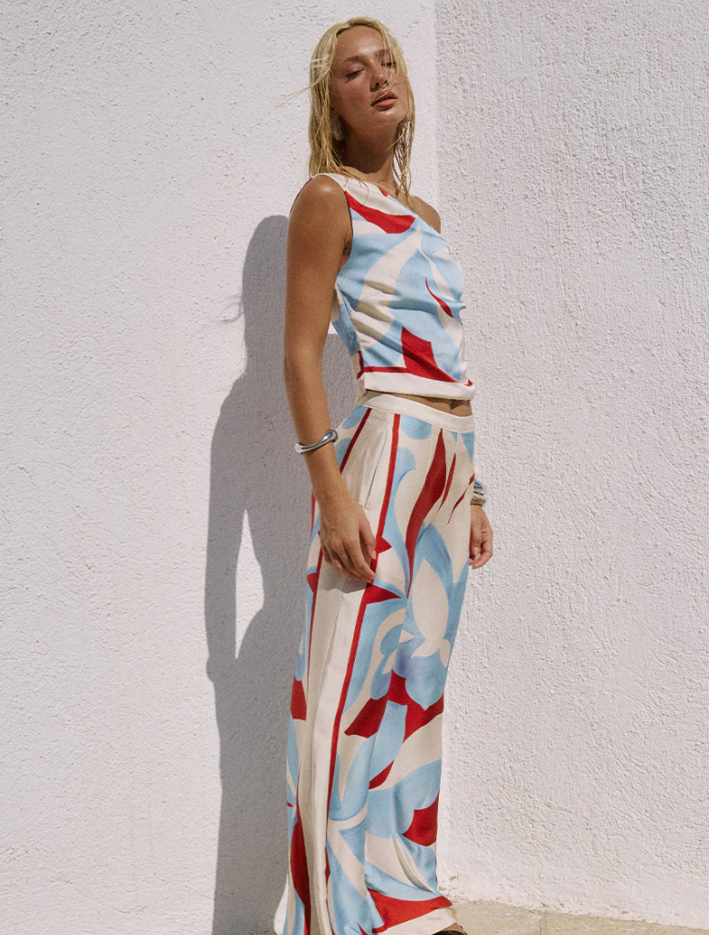 Amoree One Shoulder Tie Top in vibrant Amoree Red, featuring a stylish one-shoulder design and a tied accent.