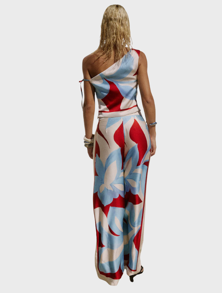 Amoree One Shoulder Tie Top in bold Amoree Red, showcasing a chic one-shoulder silhouette with a decorative tie.