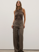 Elegant tanbark Antonia bodysuit showcased on a model, highlighting its smooth fabric and modern cut.