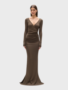 Anya maxi dress in a martini color, featuring a flowing silhouette and elegant design suitable for various occasions.