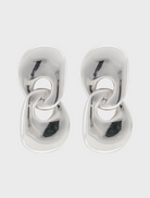 Two silver earrings featuring a circular design, elegantly crafted for a stylish accessory choice.