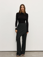 Ariya bodysuit in shadow color, featuring a sleek design and form-fitting silhouette for a modern look.
