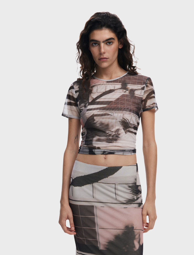 A stylish T-shirt featuring an artistic print, showcasing vibrant colors and unique designs for a trendy look.