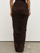 Nara skirt in a muted ash hue, designed for a relaxed silhouette, suitable for both day and evening wear.