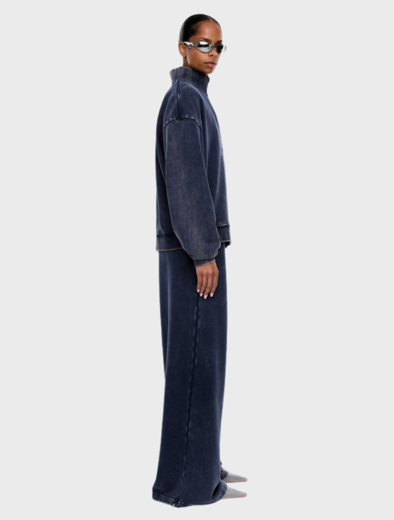 ENA PELLY's Asher Quarter Zip in Washed Ink, blending modern aesthetics with timeless elegance and luxurious fabrics.