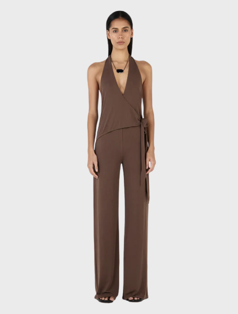 Chocolate-colored Astrid jumpsuit displayed on a mannequin, featuring a fitted bodice and wide-leg pants.