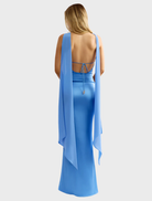 Elegant ocean blue Audrey dress featuring a tailored silhouette and a graceful, flowing skirt for special occasions.