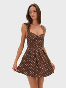 Chocolate August mini dress featuring a fitted silhouette and short sleeves, perfect for summer outings.