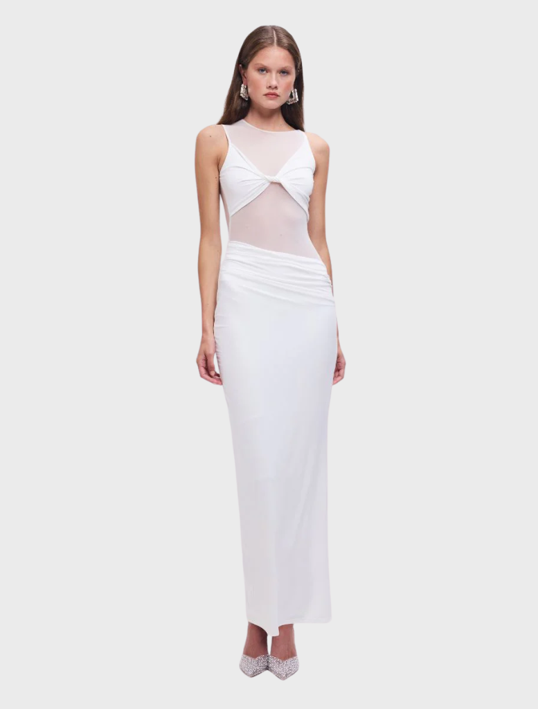 White sleeveless maxi dress with a flowing silhouette, perfect for summer occasions and casual outings.