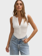  A white bodysuit made from soft, stretchy material, designed for comfort and flexibility.