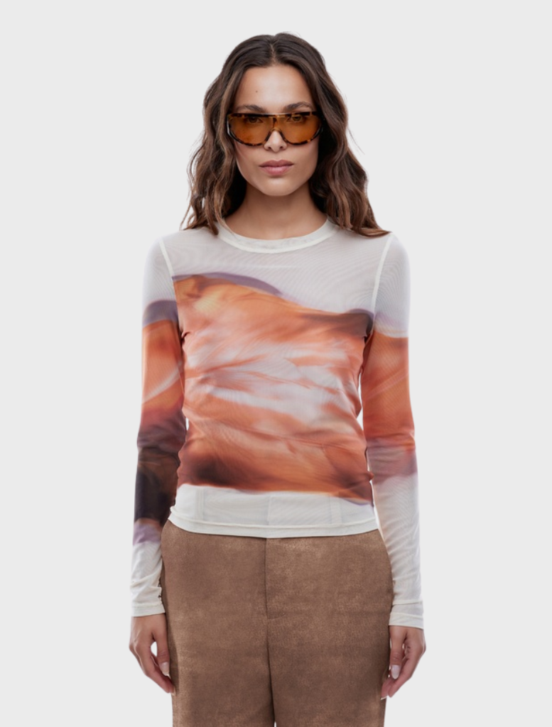Daisy long sleeve top with a rich autumn leaf print, combining comfort and seasonal style.