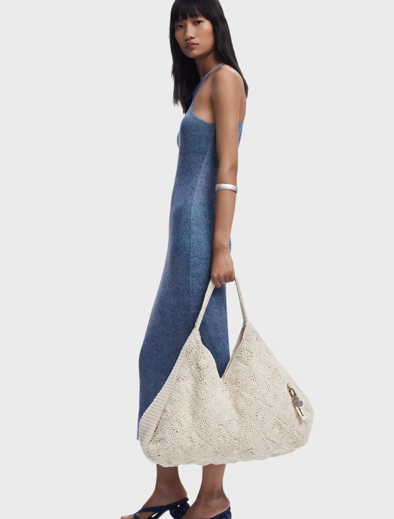 A white bag in a new shape, designed for stylish and functional use, showcasing a modern aesthetic.
