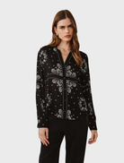 Stylish button-down shirt adorned with a bold bandana print, showcasing intricate patterns in blue and white