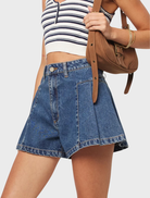 Bella's mid blue pleated shorts, designed for comfort and style, perfect for warm weather outings.