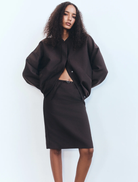 A belted midi skirt in Ristretto color, featuring a stylish design suitable for various occasions.