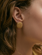 Elegant gold Bernadine earrings with intricate detailing, ideal for formal or casual occasions.
