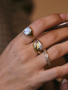 Elegant gold choke necklace with a diamond charm, identified as the Georgia Stone Omega Necklace.