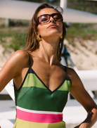 Stylish emerald stripe mini dress with a flattering cut and short sleeves, ideal for summer outings or parties.