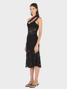 Stylish black Della dress, designed with a tailored fit and a soft, flowing skirt for a sophisticated look.