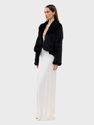Stylish black Emma Jacket hanging, showcasing a contemporary cut and versatile design for casual or formal wear.
