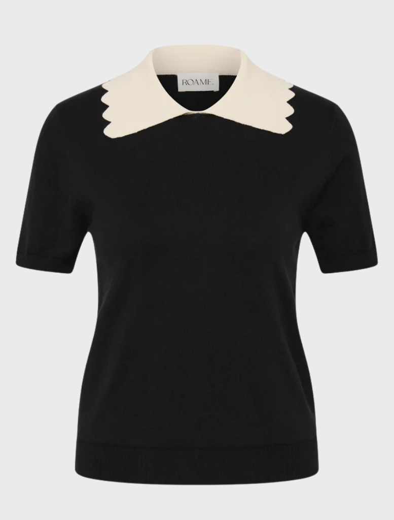 Elegant black knit top with a sleek silhouette, short sleeves, and a contrasting scalloped collar for a vintage touch.
