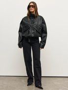 The Inez Jacket in black, showcasing a stylish cut and fabric, ideal for layering in both casual and formal settings.