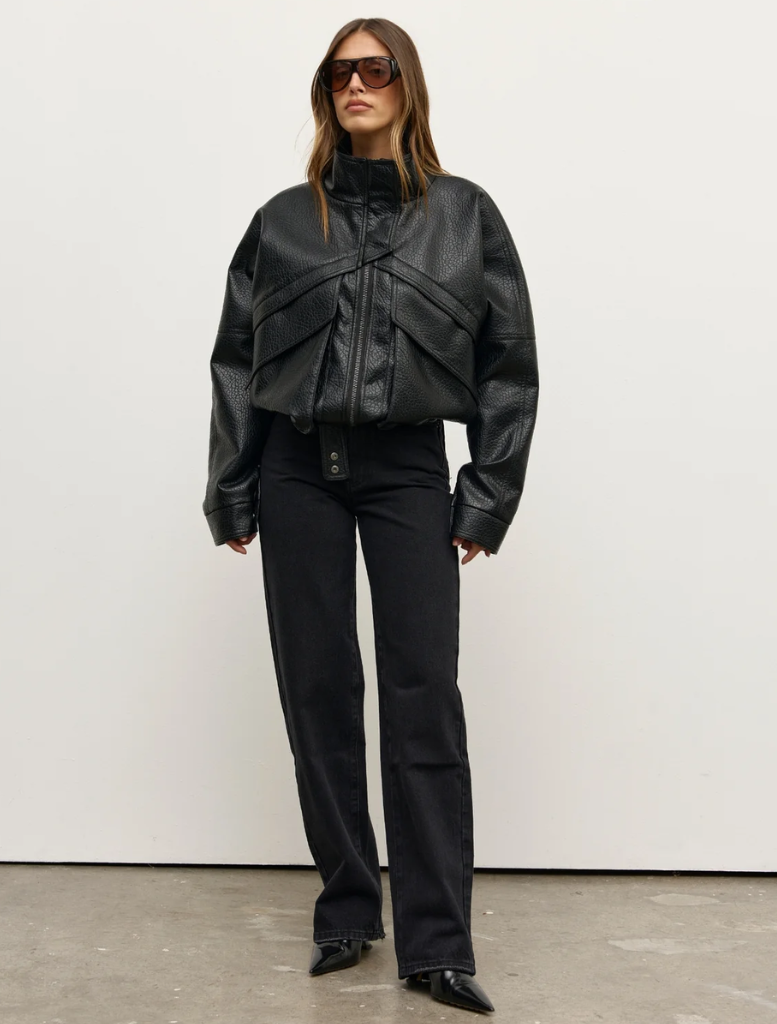 The Inez Jacket in black, showcasing a stylish cut and fabric, ideal for layering in both casual and formal settings.