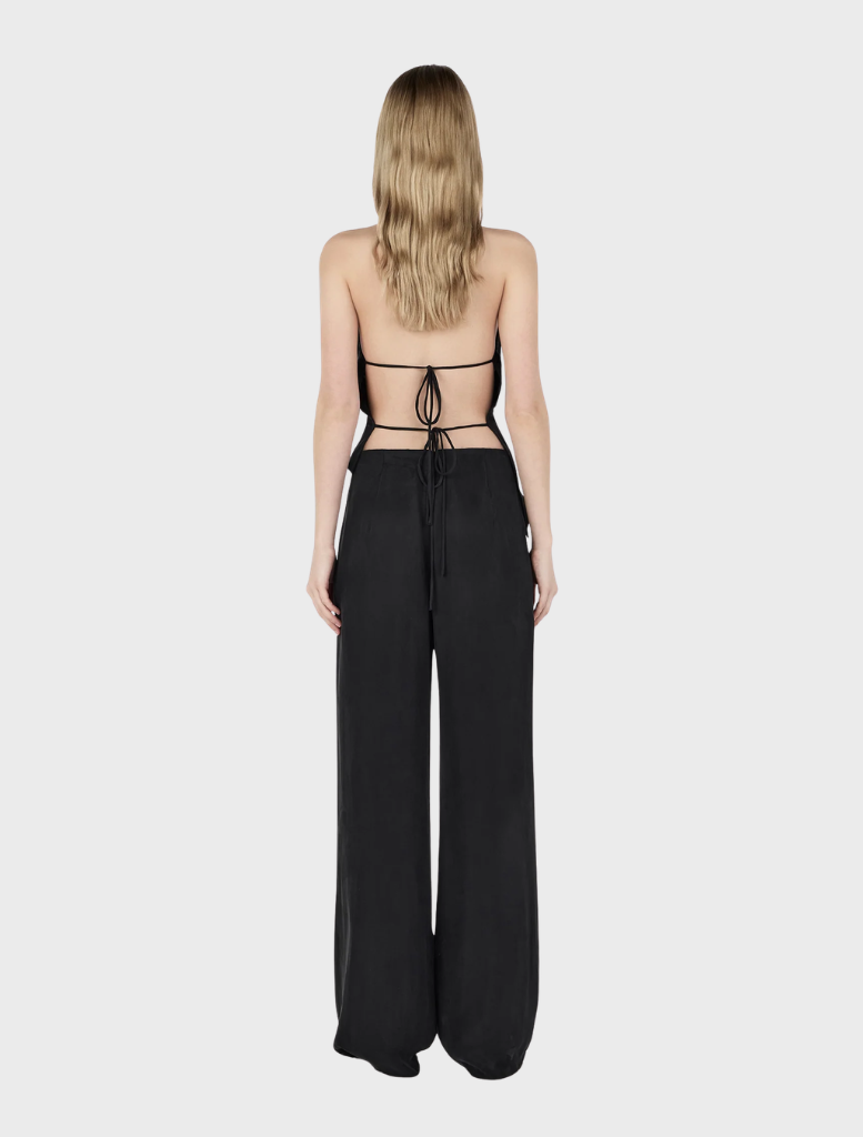 Cropped Iris Halter Top made of black leather, highlighting a chic and edgy look.
