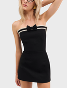 Elegant black strapless mini dress with a sleek fit, perfect for a night out or special events.