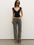 Elegant black Marianna top with a modern silhouette, suitable for various styling options.