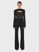 Elegant black long sleeve top from Misha, perfect for layering or standalone wear.