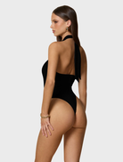 Stylish black Portia bodysuit designed for versatility, suitable for both casual and formal occasions.