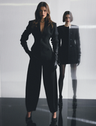 Elegant black Sonder Blazer on a hanger, showcasing a modern cut ideal for professional and formal settings.