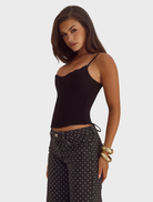 Elegant black bustier by Valerie, adorned with lace trim, designed to enhance the figure with a sophisticated touch.