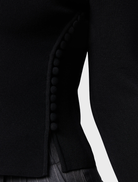 Elegant black Windsor knit top, perfect for layering or standalone wear in various settings.