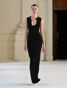 Elegant black Bloom gown featuring a flowing silhouette and delicate detailing, perfect for formal occasions.