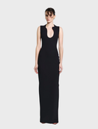 Elegant black Bloom gown featuring a flowing silhouette and delicate detailing, perfect for formal occasions.