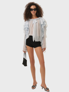 Elegant blue Lila Bow Blouse showcasing a decorative bow at the neckline, crafted from lightweight fabric.