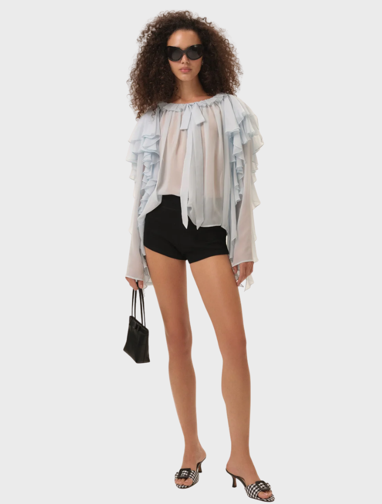 Elegant blue Lila Bow Blouse showcasing a decorative bow at the neckline, crafted from lightweight fabric.