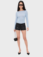 Blue Amelia Top with a pattern of small white dots, perfect for adding a touch of fun to any outfit.