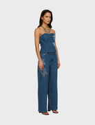 Bluestone Wynn Denim Jean, showcasing a timeless design with a deep blue color, ideal for versatile styling options.